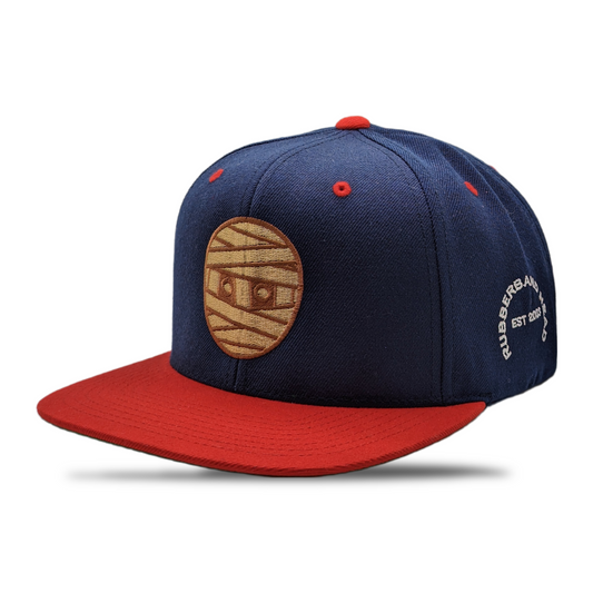 SNAPBACK CON CABEZA DE GOMA MARINO / ROJO