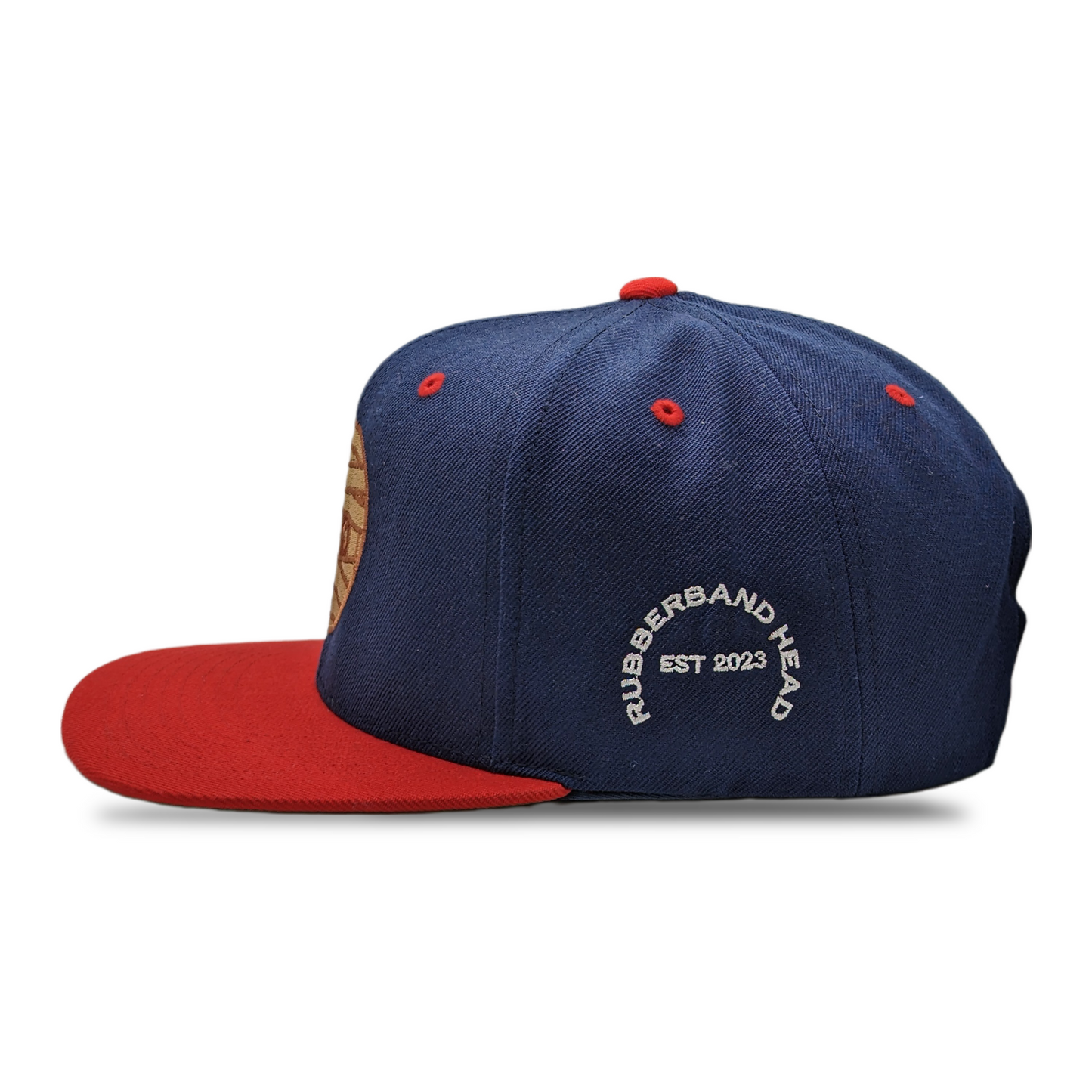 SNAPBACK CON CABEZA DE GOMA MARINO / ROJO